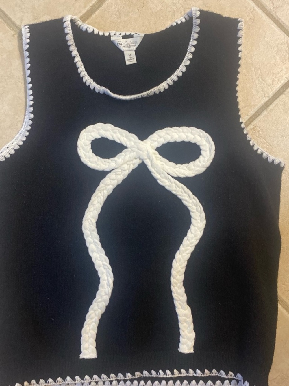 Cato Black Sleeveless Sweater Vest with White Braided Bow